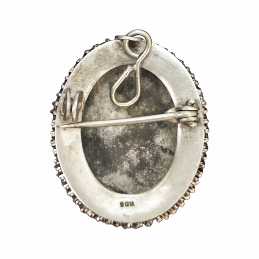 Reverse of vintage cameo brooch pendant showing 800 silver hallmark and pin fitting