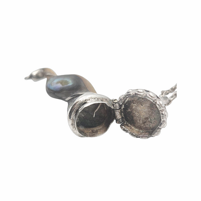 Vintage abalone scent flask pendant opened to show hollow interior and hinged silver lid