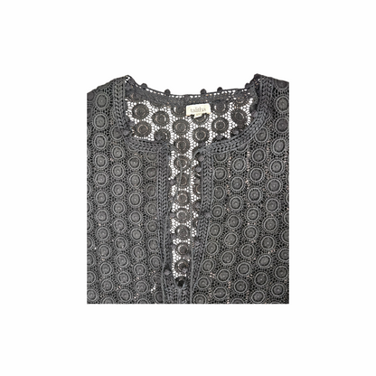 Talitha black cotton lace tunic mini dress with tassel ties, crochet-style medallion openwork and bobble trim. Mid-2010s luxury boho beach cover-up.