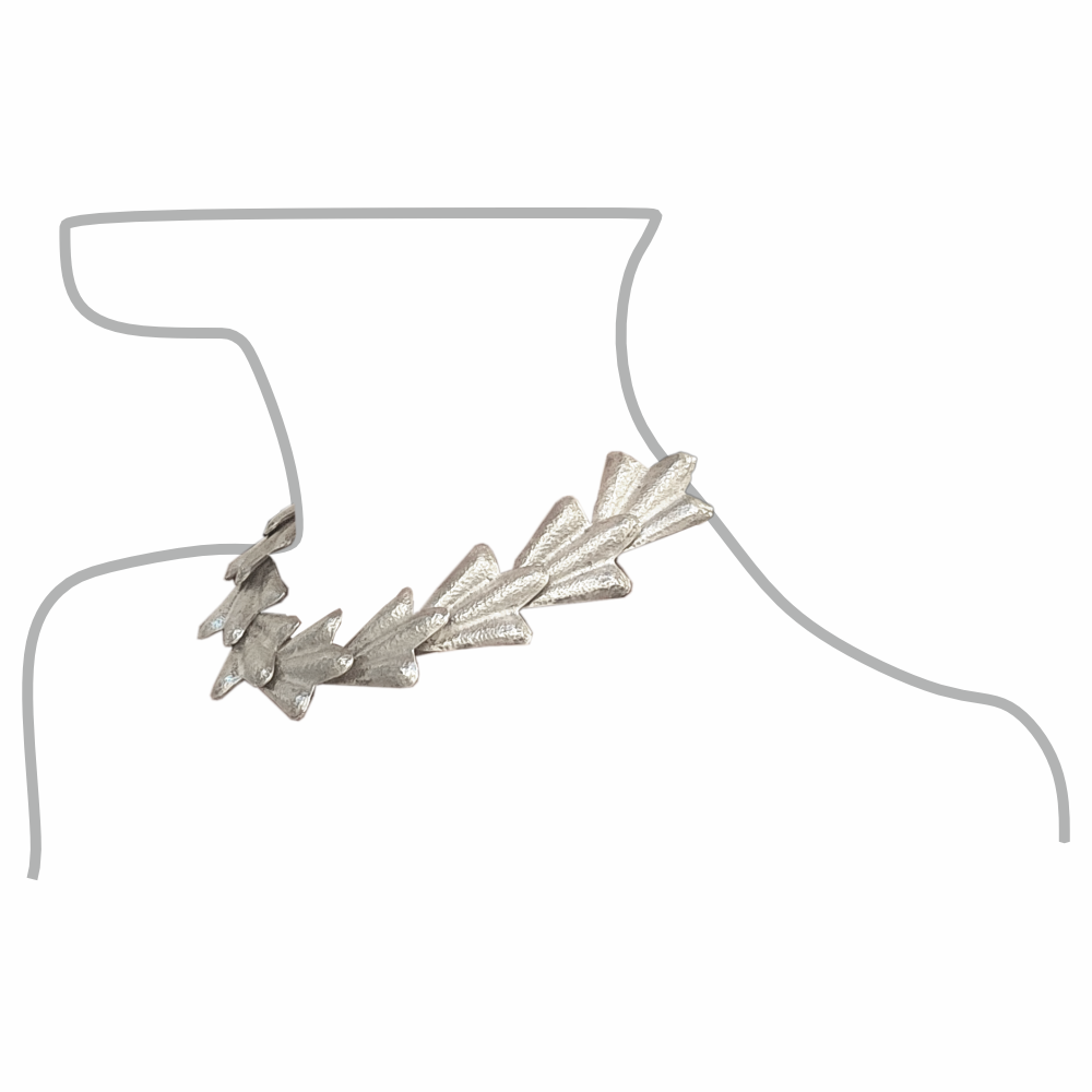 Sculptural vintage sterling silver collar necklace with overlapping leaf-shaped links, worn example.