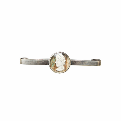 Vintage silver-tone safety pin brooch with oval Classical Renaissance-style cameo portrait medallion, aged patina and curled pin terminals.