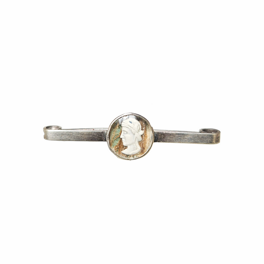 Vintage silver-tone safety pin brooch with oval Classical Renaissance-style cameo portrait medallion, aged patina and curled pin terminals.