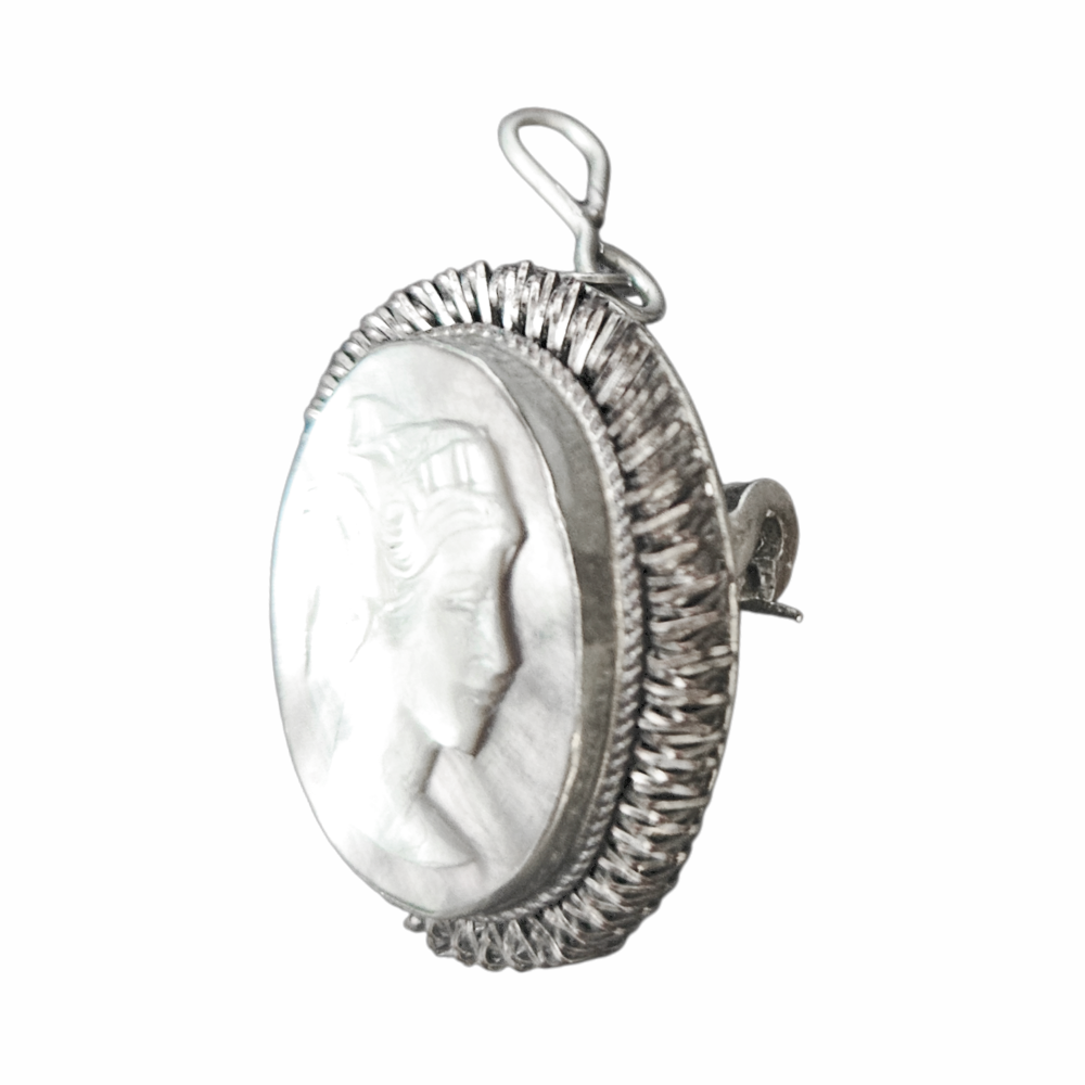 Side view of carved cameo in ornate 800 silver rope-style setting