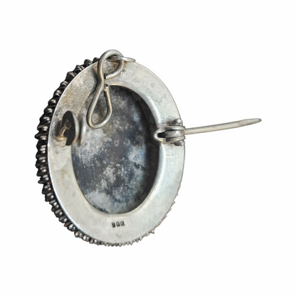 Back of 800 silver cameo pendant with aged silver patina

Shopify metafield