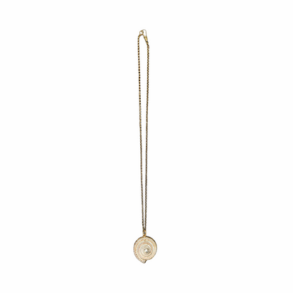 Vintage Shiva eye shell spiral pendant necklace on an antiqued gold-tone chain. Natural sea-shell talisman jewellery with a delicate bohemian look.