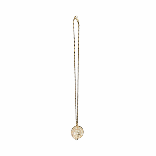 Vintage Shiva eye shell spiral pendant necklace on an antiqued gold-tone chain. Natural sea-shell talisman jewellery with a delicate bohemian look.