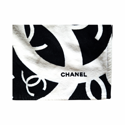 Close-up of black and white oversized CHANEL interlocking CC logo design and terry cotton texture