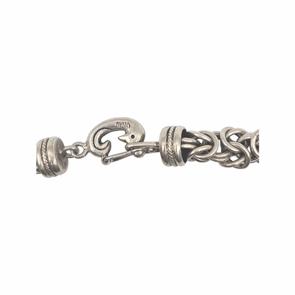 Vintage 950 silver statement necklace with dense Byzantine-style woven links, decorative wrapped spacer collars and sculptural hook clasp. Substantial artisan silver jewellery.
