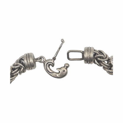 Vintage 950 silver statement necklace with dense Byzantine-style woven links, decorative wrapped spacer collars and sculptural hook clasp. Substantial artisan silver jewellery.