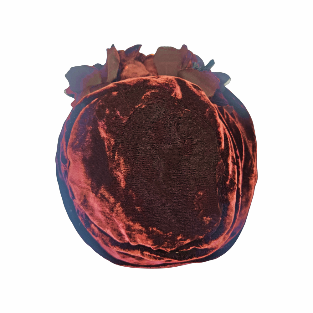 Top view of Donna Karan velvet hat with layered fabric flowers