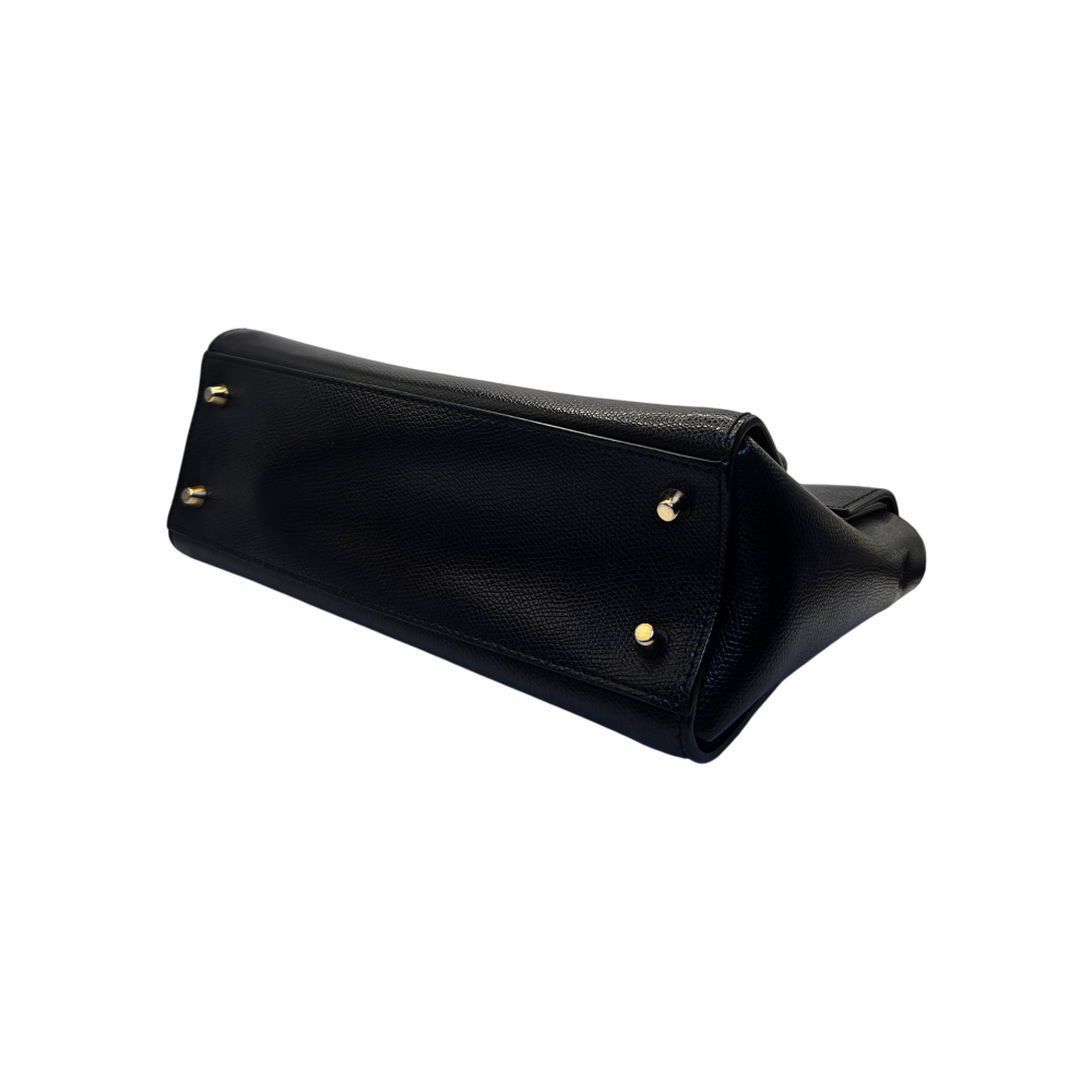 Base of Furla black leather Metropolis bag with protective gold-tone feet