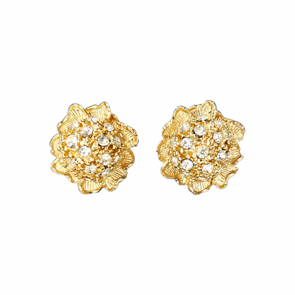 A pair of vintage 1970s gold tone flower-shaped stud earrings embellished with small clear rhinestones