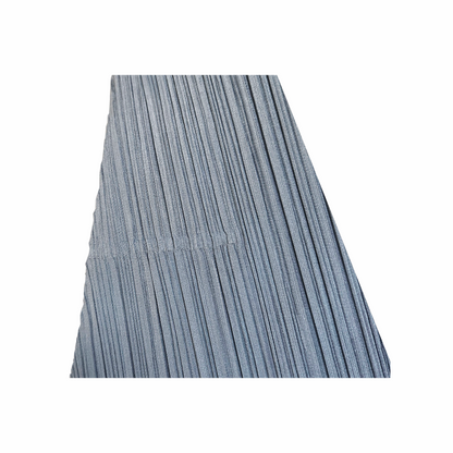 Close-up of silver-green
 permanent vertical pleating and A-line skirt construction on Issey Miyake dress