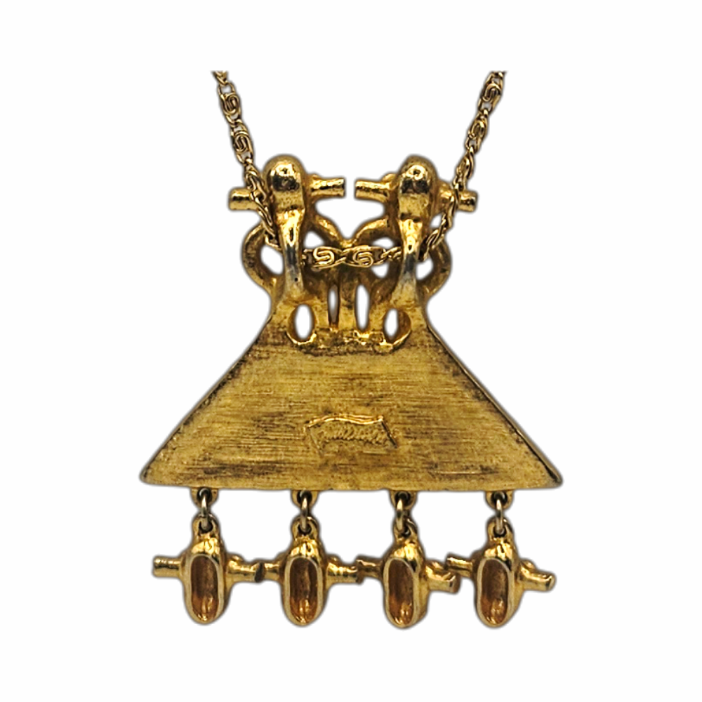 1980s Judith Leiber gold-plated figural pendant necklace with articulated drops and West African-inspired - likely inspired by senufo amulettes - sculptural detailing. Signed vintage designer jewellery.