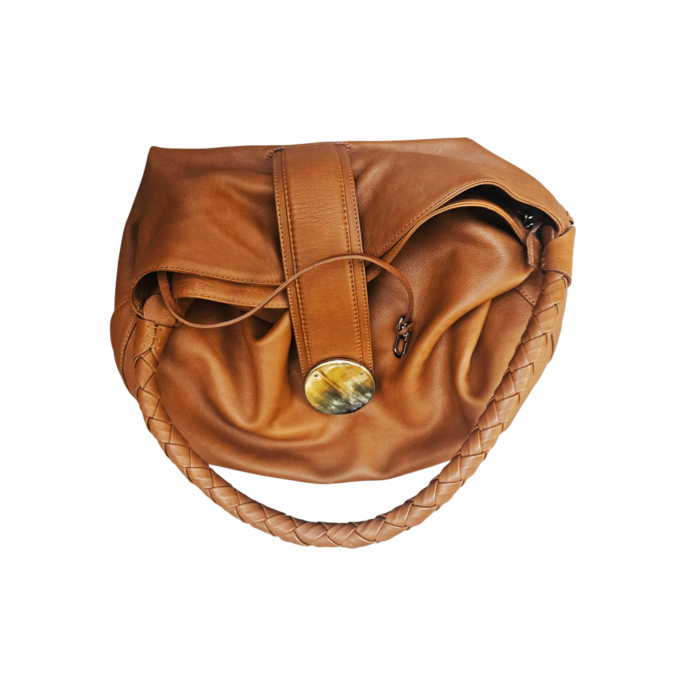 Kenall tan leather hobo bag with braided handle, horn-style disc fastening and hand-laced detailing. A distinctive cognac leather shoulder bag.