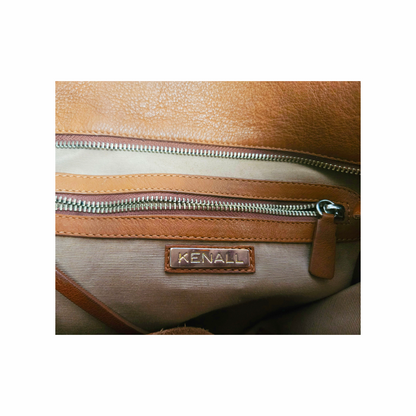 
Kenall tan leather hobo bag with braided handle, horn-style disc fastening and hand-laced detailing. A distinctive cognac leather shoulder bag.