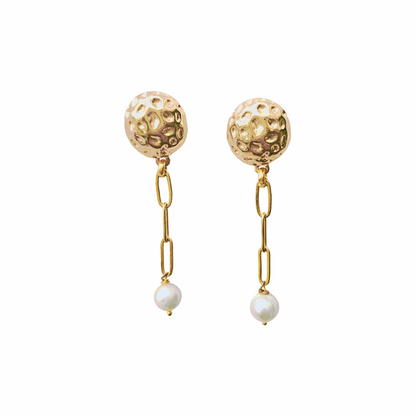 Gold-tone hammered button drop earrings with paperclip chain links and cultured freshwater pearl drops. Sculptural statement earrings with a modern organic finish.