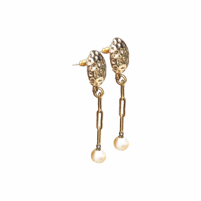 Gold-tone hammered button drop earrings with paperclip chain links and cultured freshwater pearl drops. Sculptural statement earrings with a modern organic finish.
