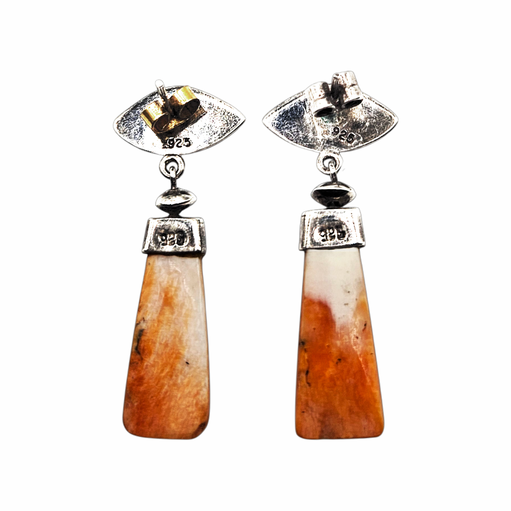 Back of vintage sterling silver shell earrings showing 925 hallmarks and post fittings
