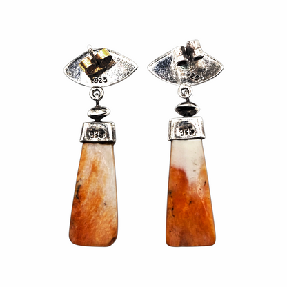Back of vintage sterling silver shell earrings showing 925 hallmarks and post fittings
