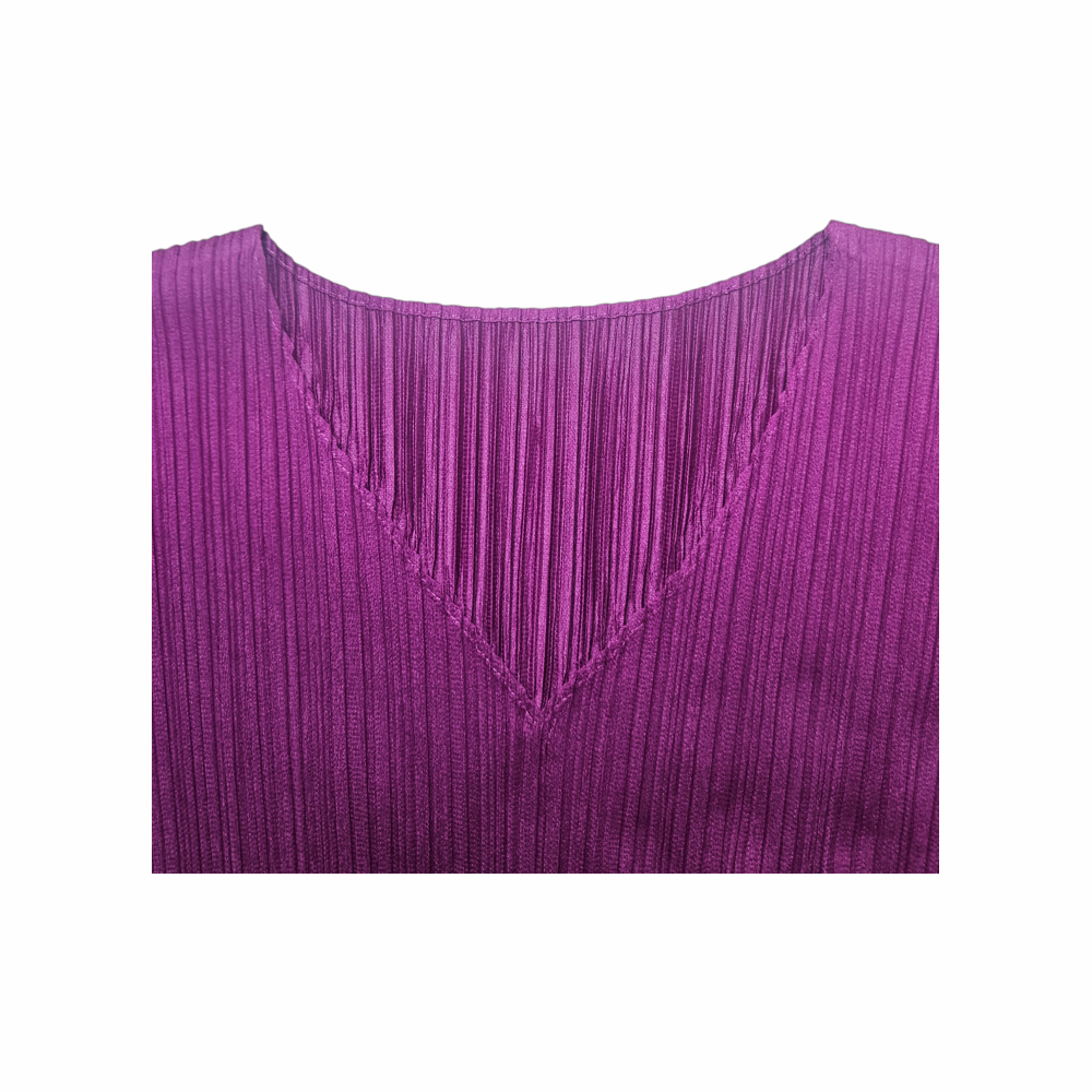 V-neck detail on plum purple Pleats Please Issey Miyake pleated dress