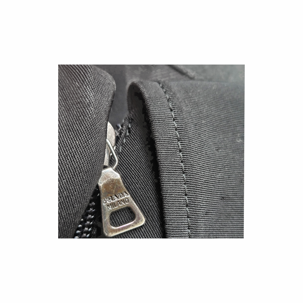Prada Milano black fitted tailored jacket, Made in Italy, size 42, with sculpted seam detailing, full lining, Prada branded zips and pockets.