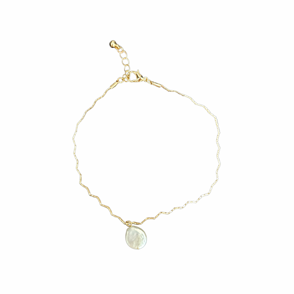 Gold-tone short necklace with an irregular mother-of-pearl disc pendant, textured chain and adjustable lobster-clasp fastening.