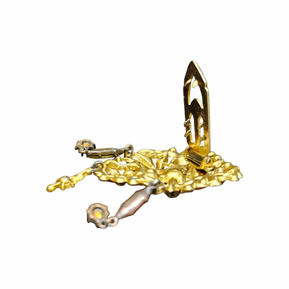 Back of Vintage multicolour rhinestone floral dress clip with gold-tone openwork leaves and articulated blue glass drops, dating from approximately the 1930s–1940s.