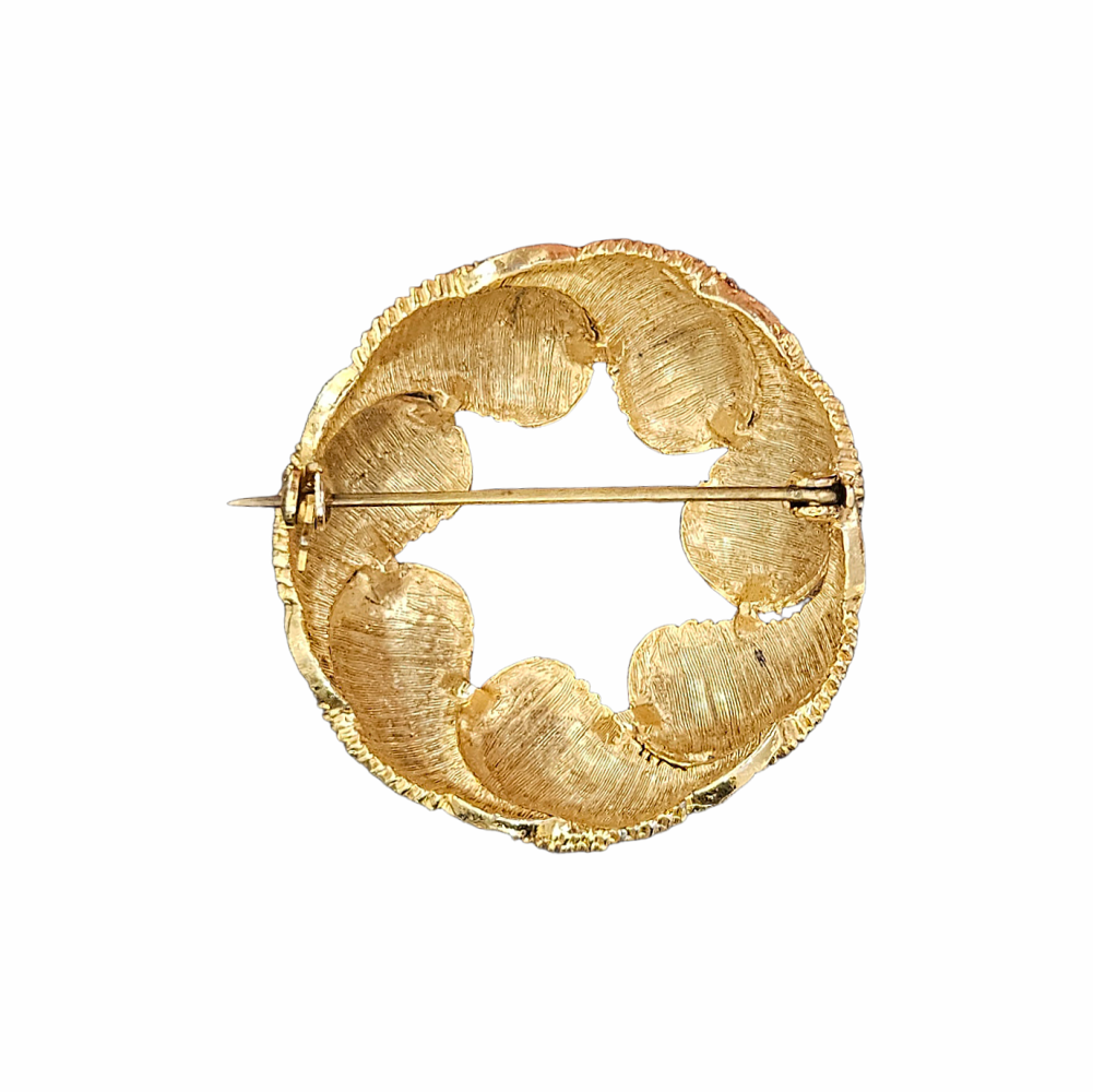 Vintage gold-tone feather leaf wreath brooch with textured ribbed detailing, circa 1960s–1970s.