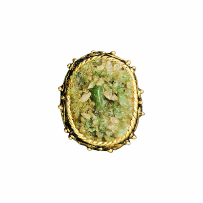 Vintage green hardstone chip mosaic oval brooch in ornate antiqued gold-tone metal, circa 1960s–1970s.
